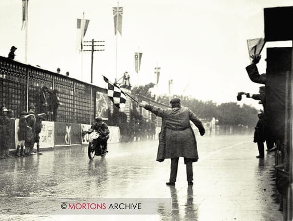 Wal Handley crosses the finishing line to claim a record-breaking TT win.